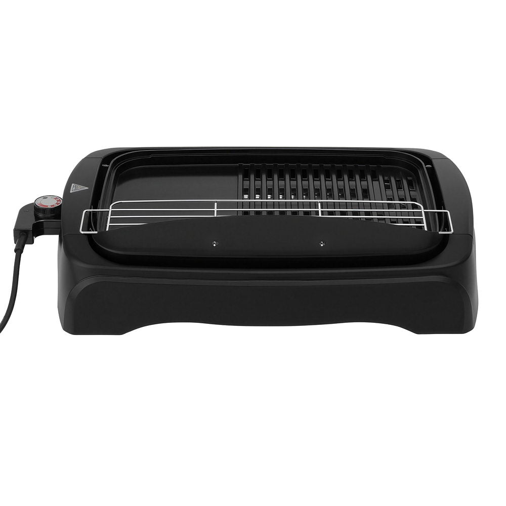 Black electric grill on a white background