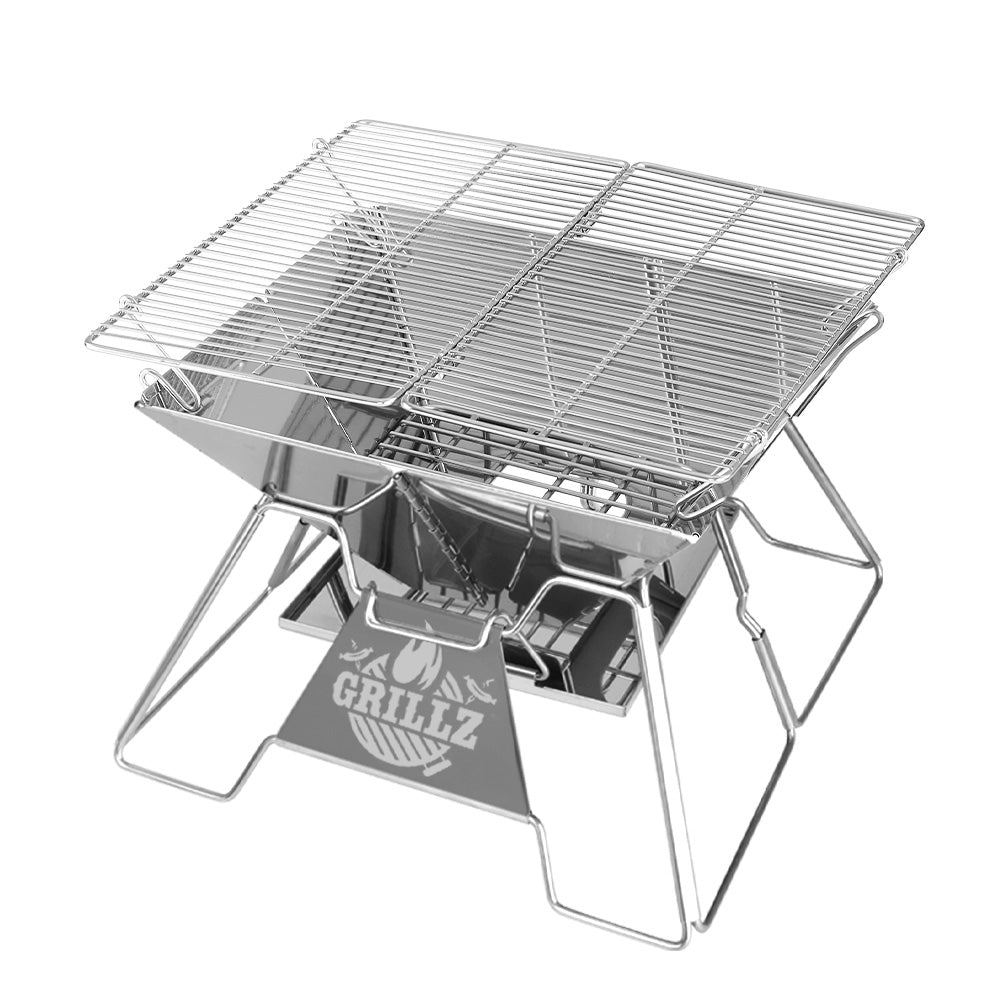 Portable metal grill with a stand on a white background