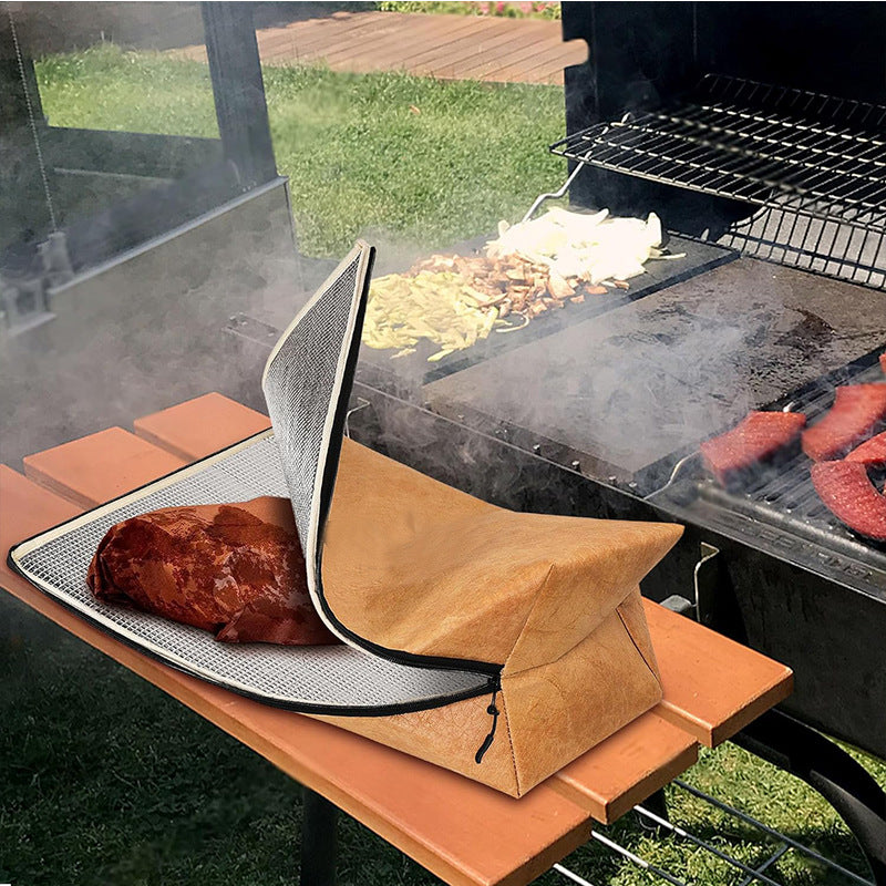 Barbecue grill with a wooden board, grill basket, and food items on a grassy outdoor setting