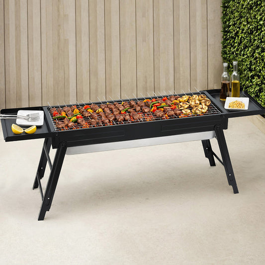 Portable grill with food on a patio

